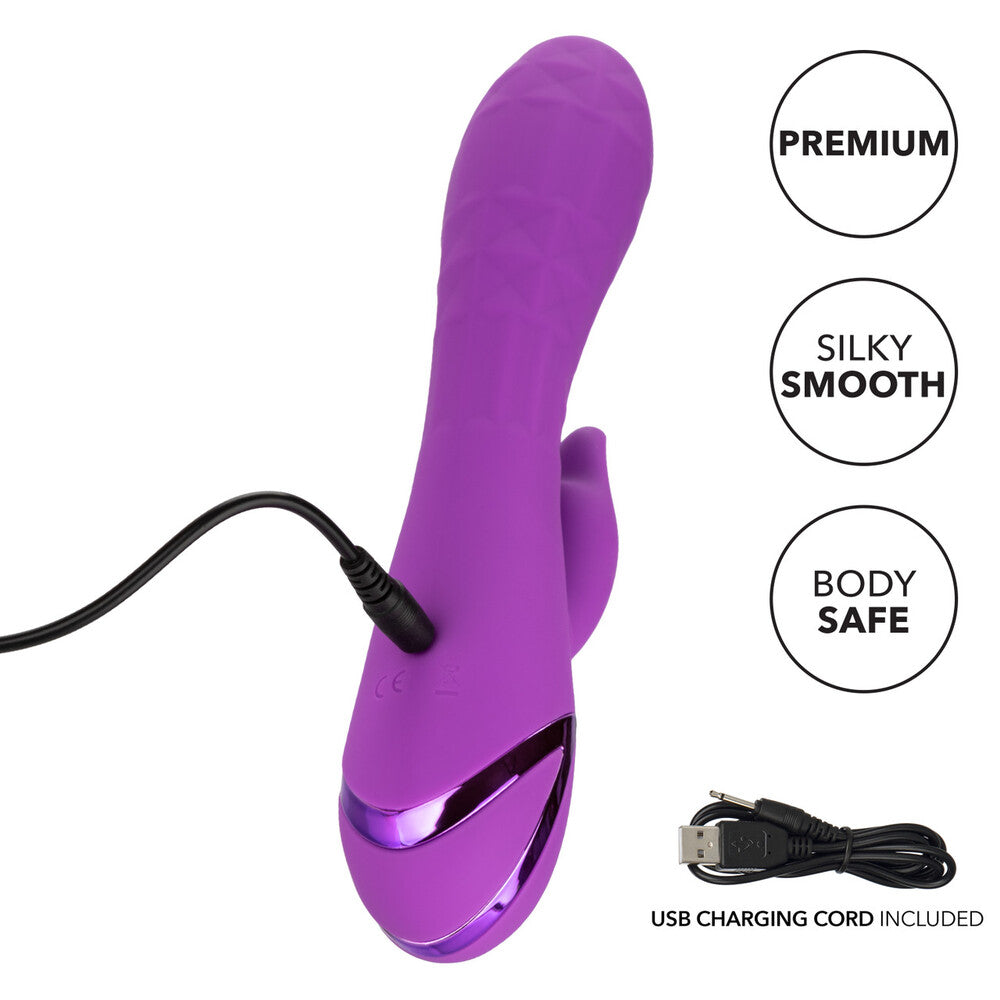 Close-up of a purple, rechargeable clit vibrator with a textured, curved stimulator head.