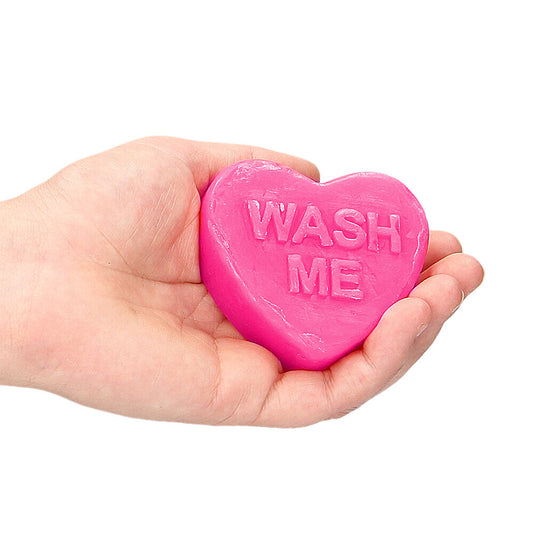 Heart-shaped, blood red soap bar with 'Wash Me' engraved, a cheeky novelty gift.