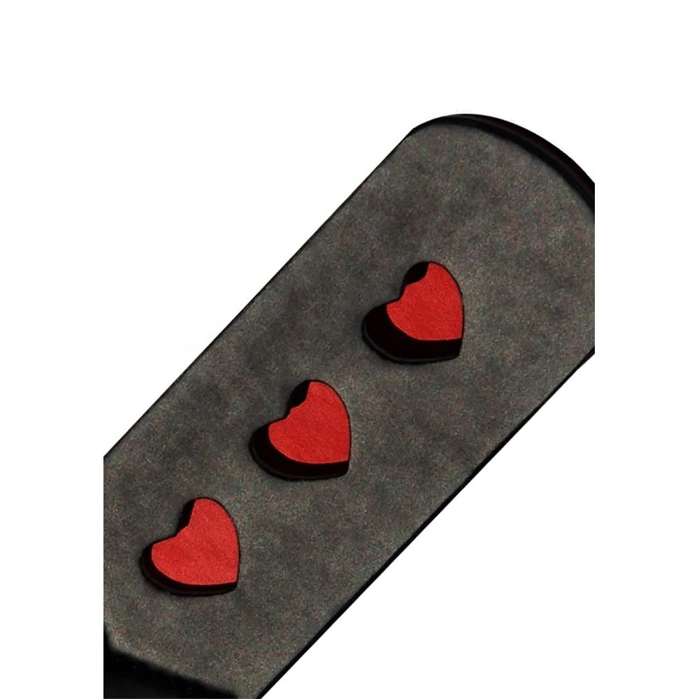 Sportsheets sex and mischief heart paddle, a red faux leather spanking implement for playful fun.