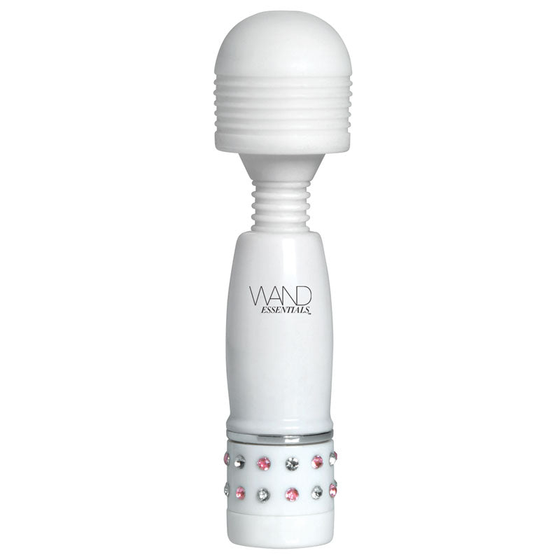 Close-up of a small, lilac massage wand with a smooth, rounded head for focused use.