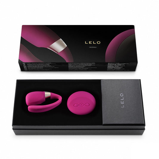 Close-up of a cherry-red Lelo Tiani 3 rechargeable massager with a smooth, luxurious finish.