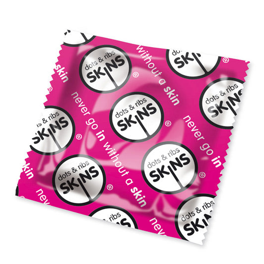 Pink box of Skins Dots and Ribs condoms, pack of fifty, for stimulating pleasure.
