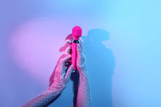 Image of the best vibrator on a vibrant, purple and blue background.