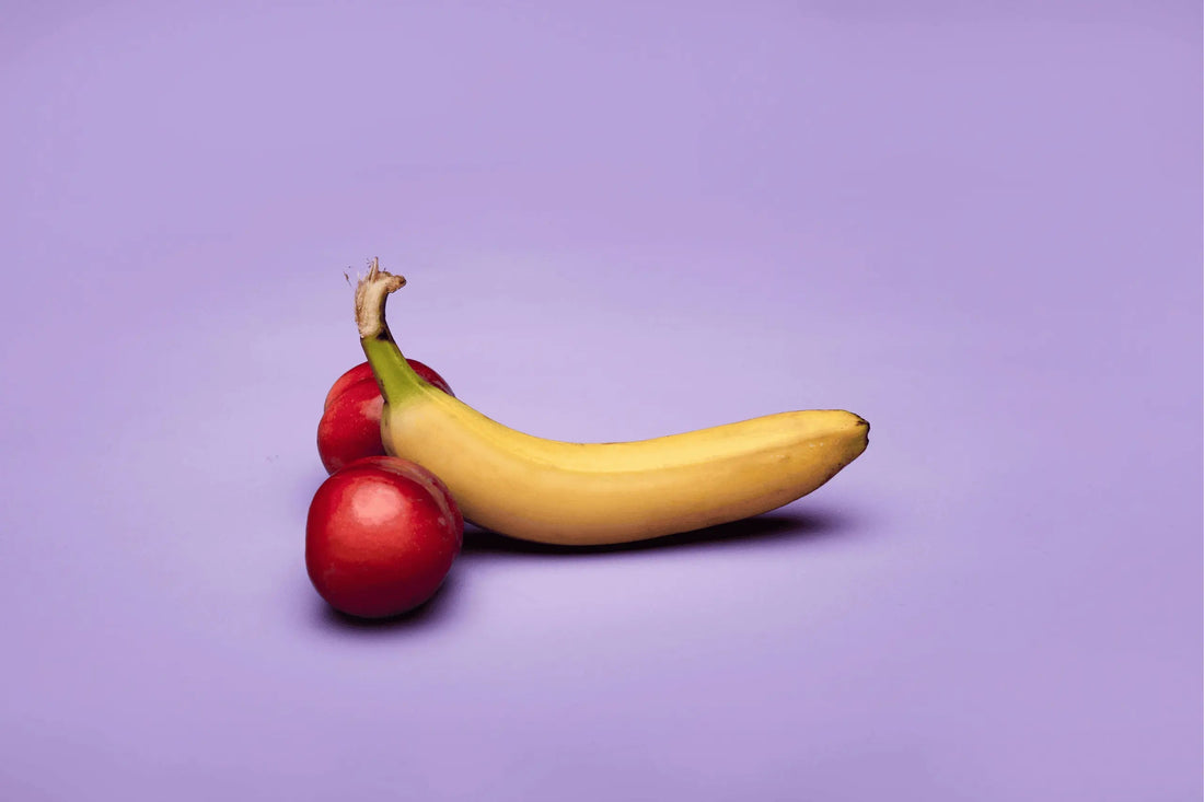 Do Penis Pumps Work? - Image of a banana and two apples, positioned to look like a penis.
