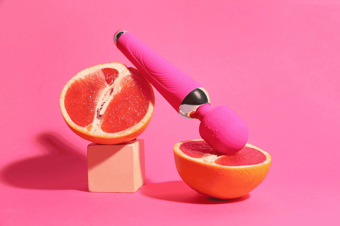 How to use a vibrator - Image of a pink vibrator next to a grapefruit.