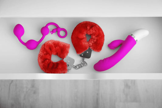 Image of sex toys for pelvic floor health stored in a white bedside drawer.