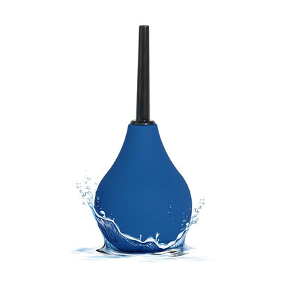 ToyJoy The Cleaner douche, a clear liquid in a small white bottle for personal hygiene.