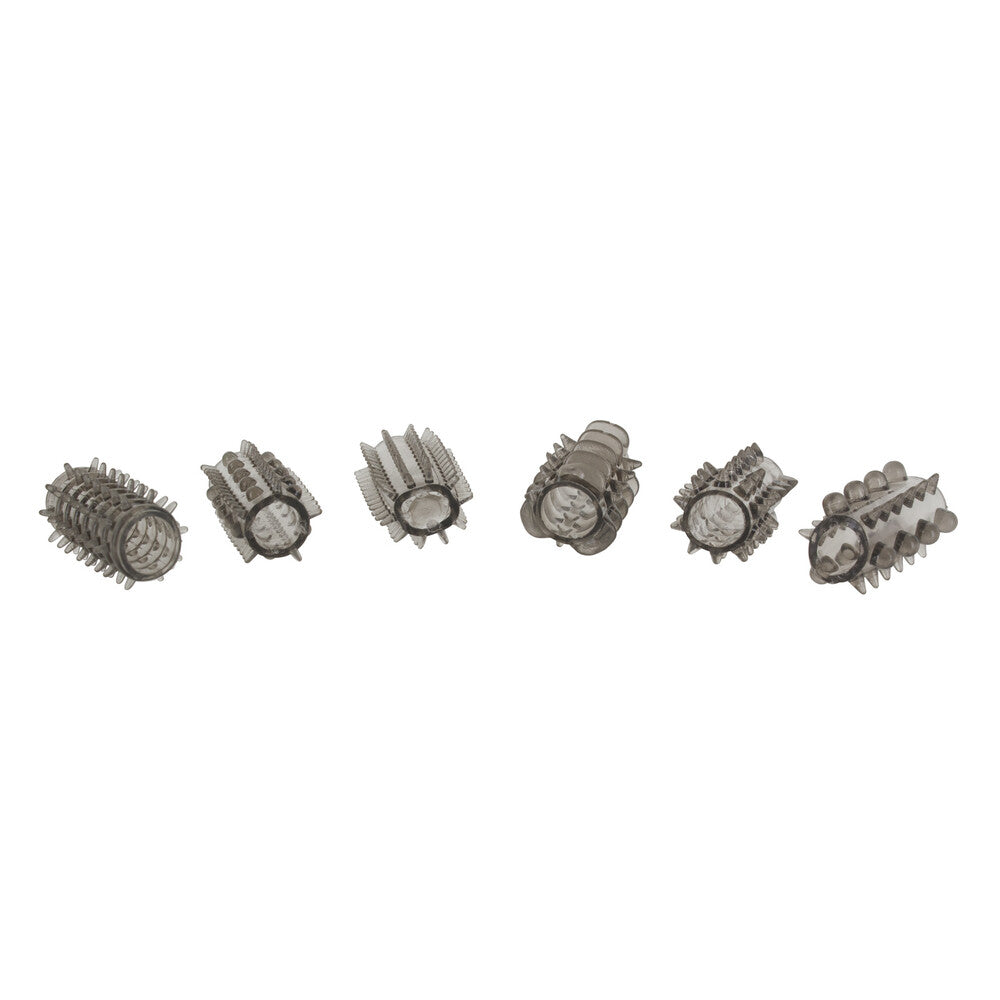 A grey ToyJoy penis sleeve set, showing textured designs and a soft, flexible material.