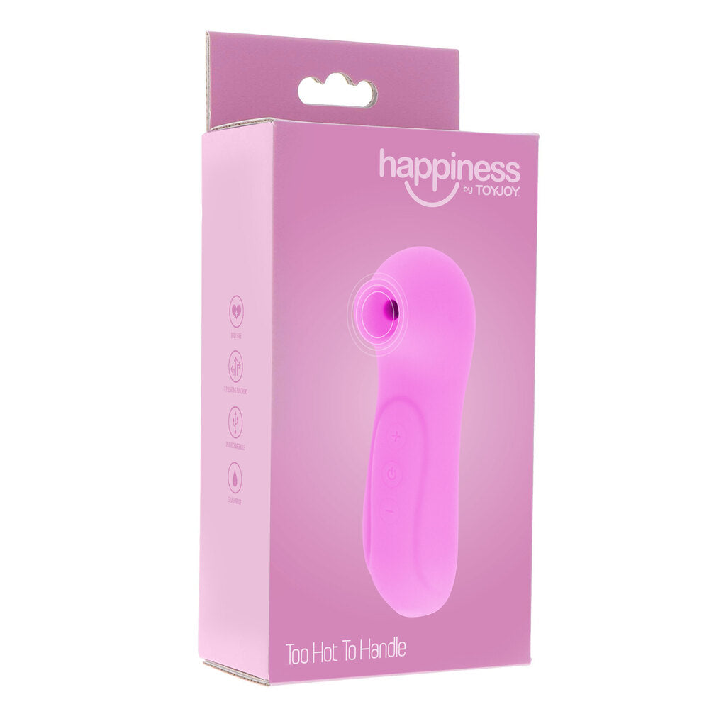 Close-up of a red, rounded clitoral vibrator from Toy Joy, showcasing its smooth finish.