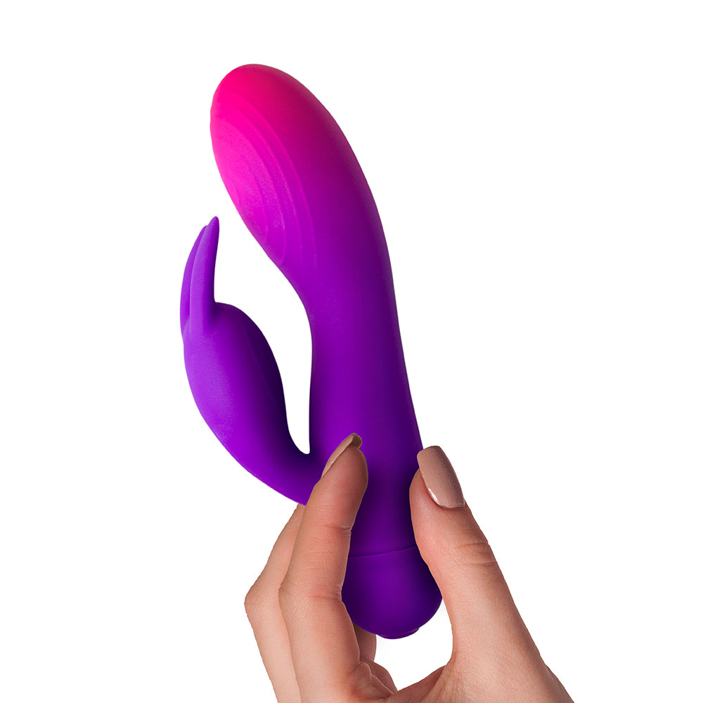 Glow-in-the-dark bunny vibrator with dual stimulation for both clitoral and vaginal pleasure, featuring a smooth finish.