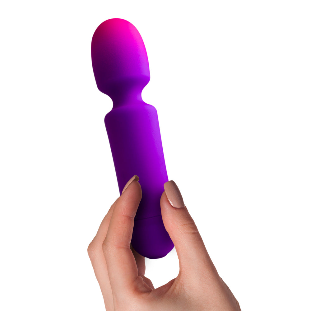 Glow-in-the-dark purple wand massager with a smooth finish, designed for personal pleasure.