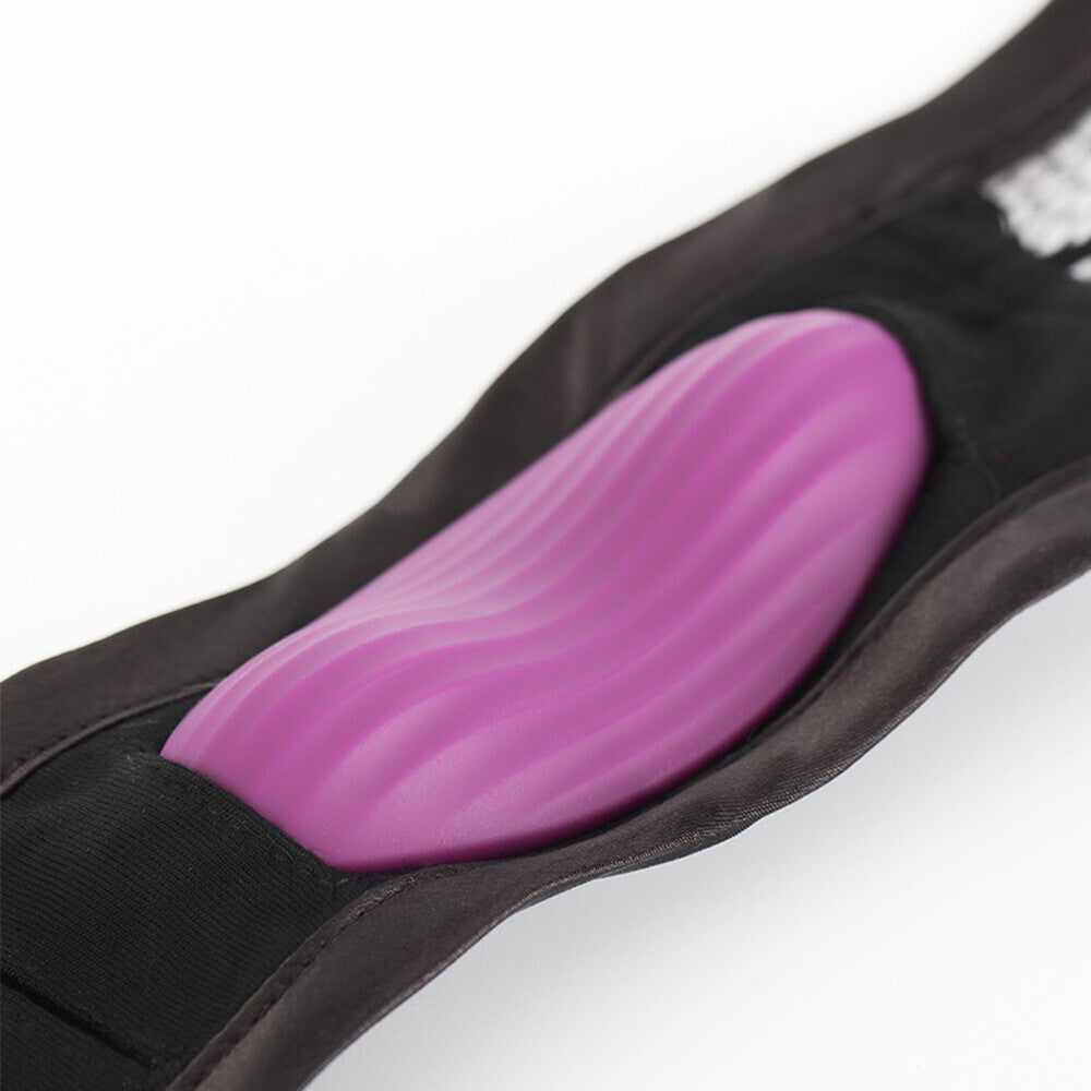 Svakom Edeny clitoral stimulator, sleek white silicone with a curved, ergonomic design for pleasure.