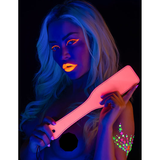 A pink Taboom paddle that glows in the dark, ideal for playful evenings.