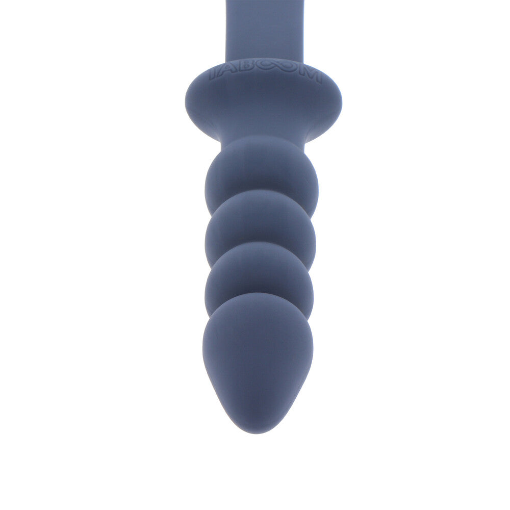 Taboom silicone paddle with a black handle and a graduated, flexible purple plug