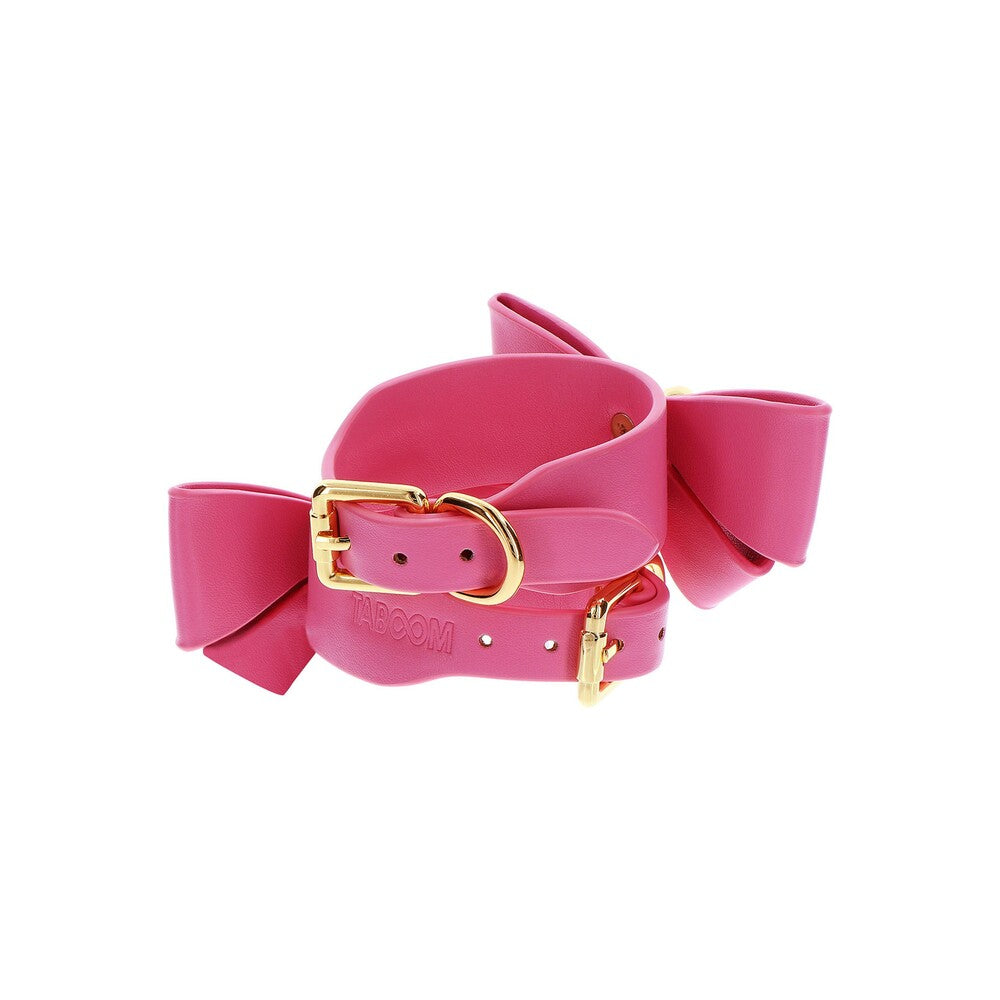 Malibu wrist cuffs, part of the Taboom handcuff collection, close-up on soft pink leather