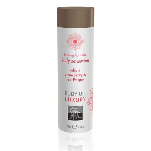 Shiatsu strawberry and red pepper body oil, a red tinted edible massage oil in a bottle.