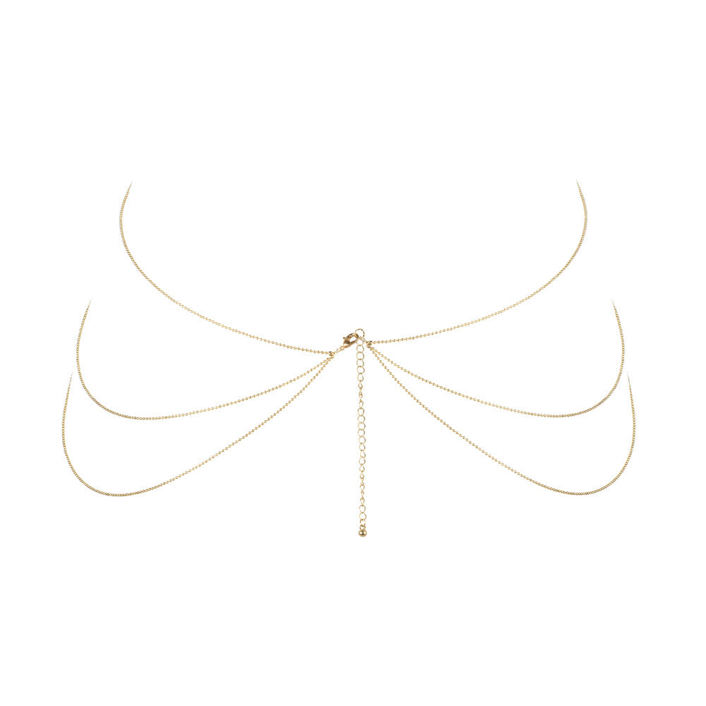 Gold-tone body chain, a stunning piece of body jewellery from bijoux indiscrets, catches the light.