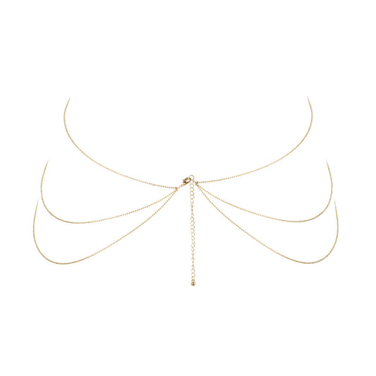 Gold-tone body chain, a stunning piece of body jewellery from bijoux indiscrets, catches the light.