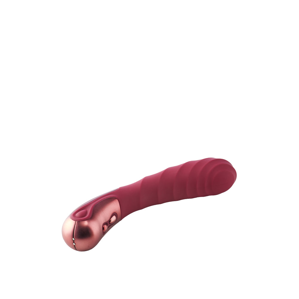 Dinky single vibrator in a smooth, pale pink material, designed for targeted pleasure.