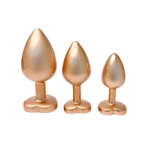 A set of dream toys gold-coloured anal plugs with lustrous pearl detailing, proper cheeky.