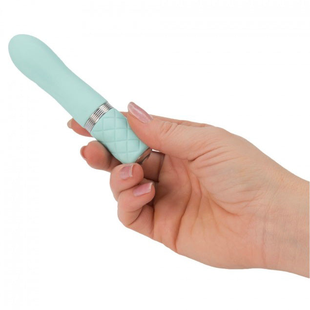 Teal rechargeable bullet vibrator, small and discreet, for intimate moments. Mini vibrator by BMS Enterprises.