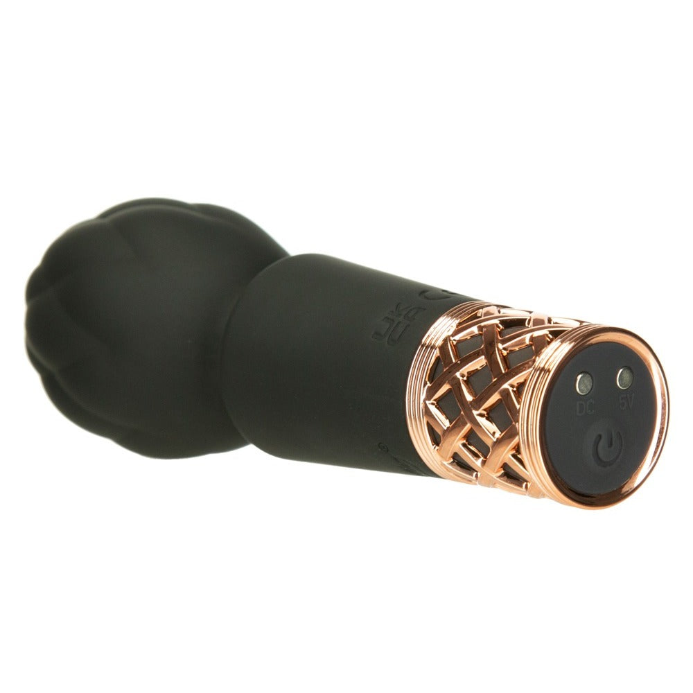 Close-up of the Pillow Talk Secrets mini vibrator, a small purple pleasure massager.
