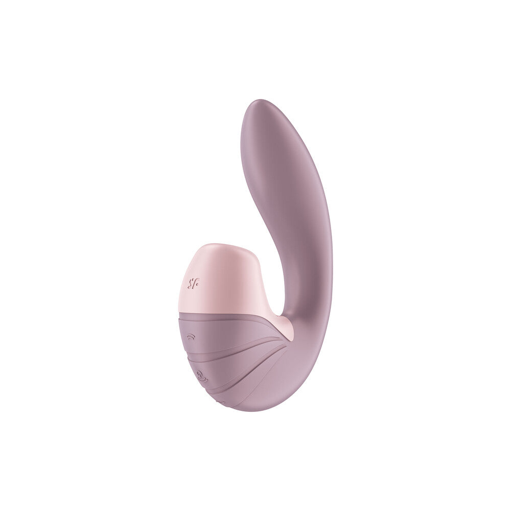 Close-up of the Satisfyer Supernova clitoral stimulator in pink, featuring a textured surface.