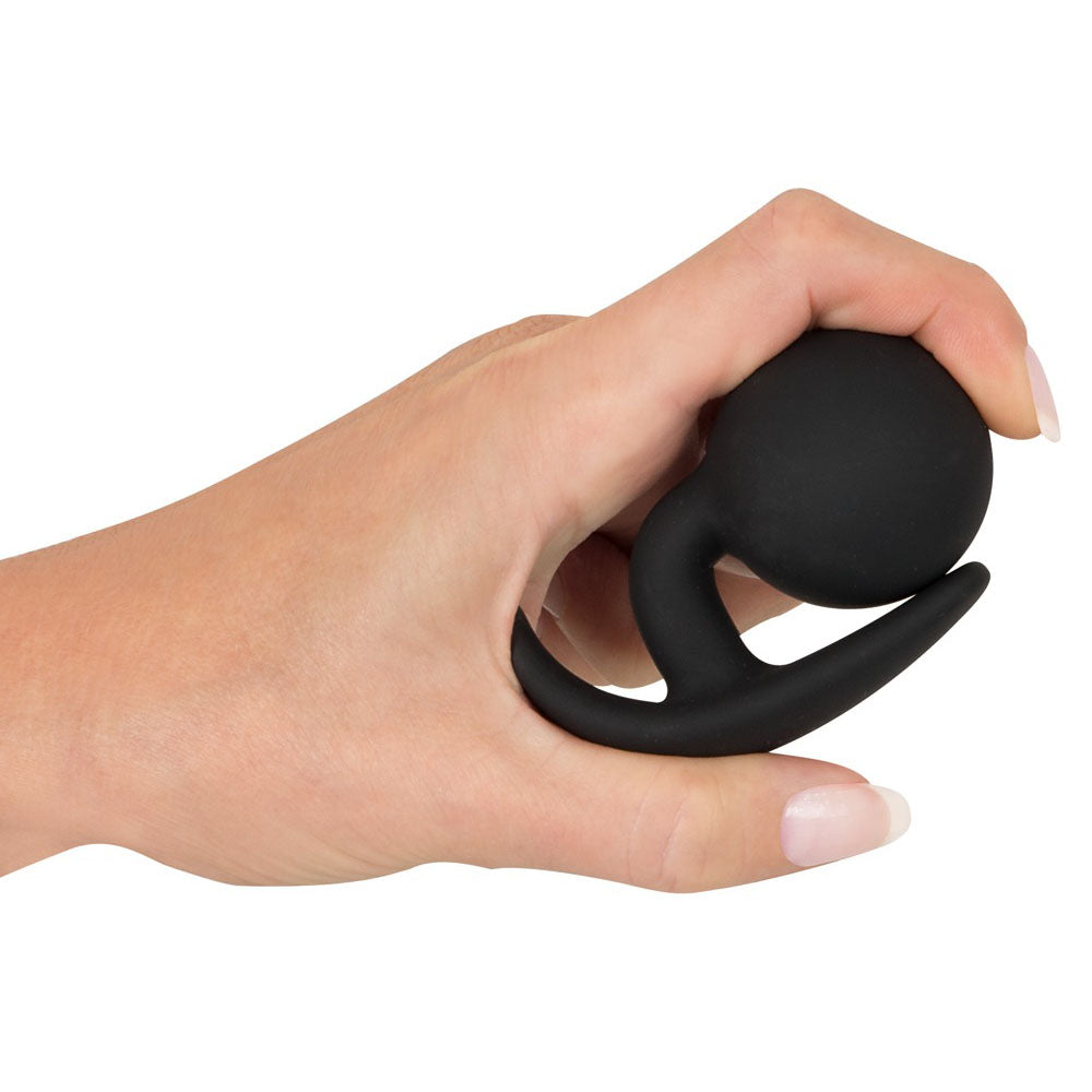 A medium-sized You2Toys butt plug with a flared base, smooth black silicone finish.