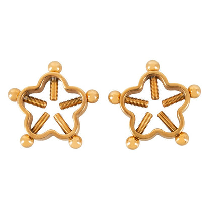 Close-up of golden flower nipple jewellery, a glamorous and daring body adornment.