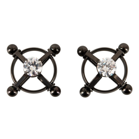 A pair of shiny, star-shaped nipple jewels for body adornment, perfect for adding some sparkle.