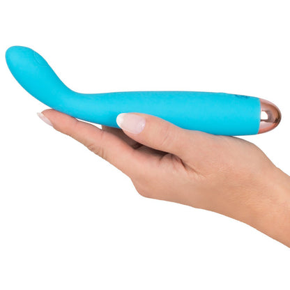 Small, rechargeable blue vibrator with a smooth, silk-touch finish for personal pleasure.