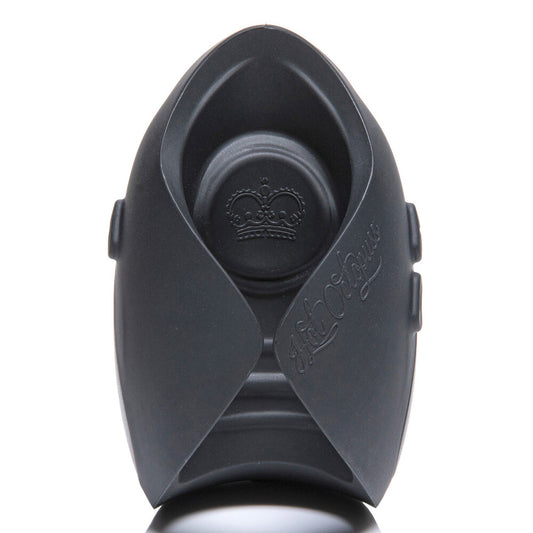 Pulse Solo essential guybrator masturbator in dark grey with ribbed texture and charging plate.