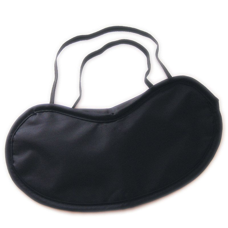 Close-up of a silky black eye mask for sleeping or adding a touch of fun.