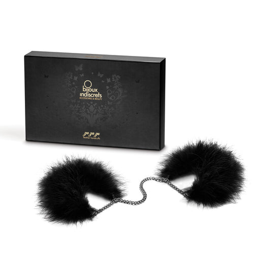 Bijoux Indiscrets feather handcuffs, light pink with a soft, luxurious finish, playful restraint.