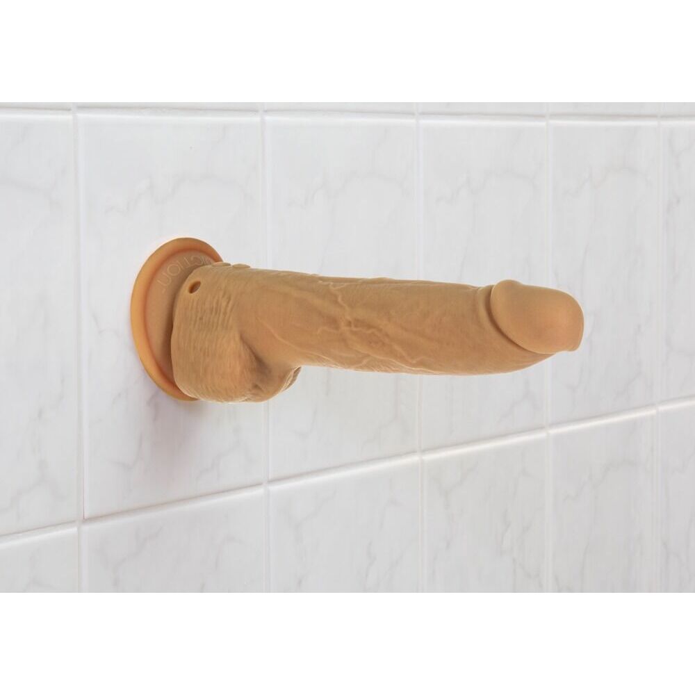 Caramel-coloured, nine-inch thrusting dildo with a realistic texture, designed for intimate pleasure.