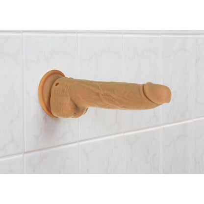Caramel-coloured, nine-inch thrusting dildo with a realistic texture, designed for intimate pleasure.