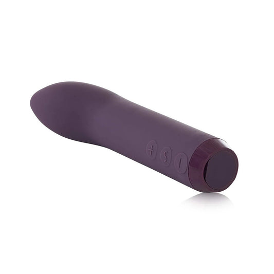 A small, purple, bullet-shaped vibrator; a discreet personal pleasure device.