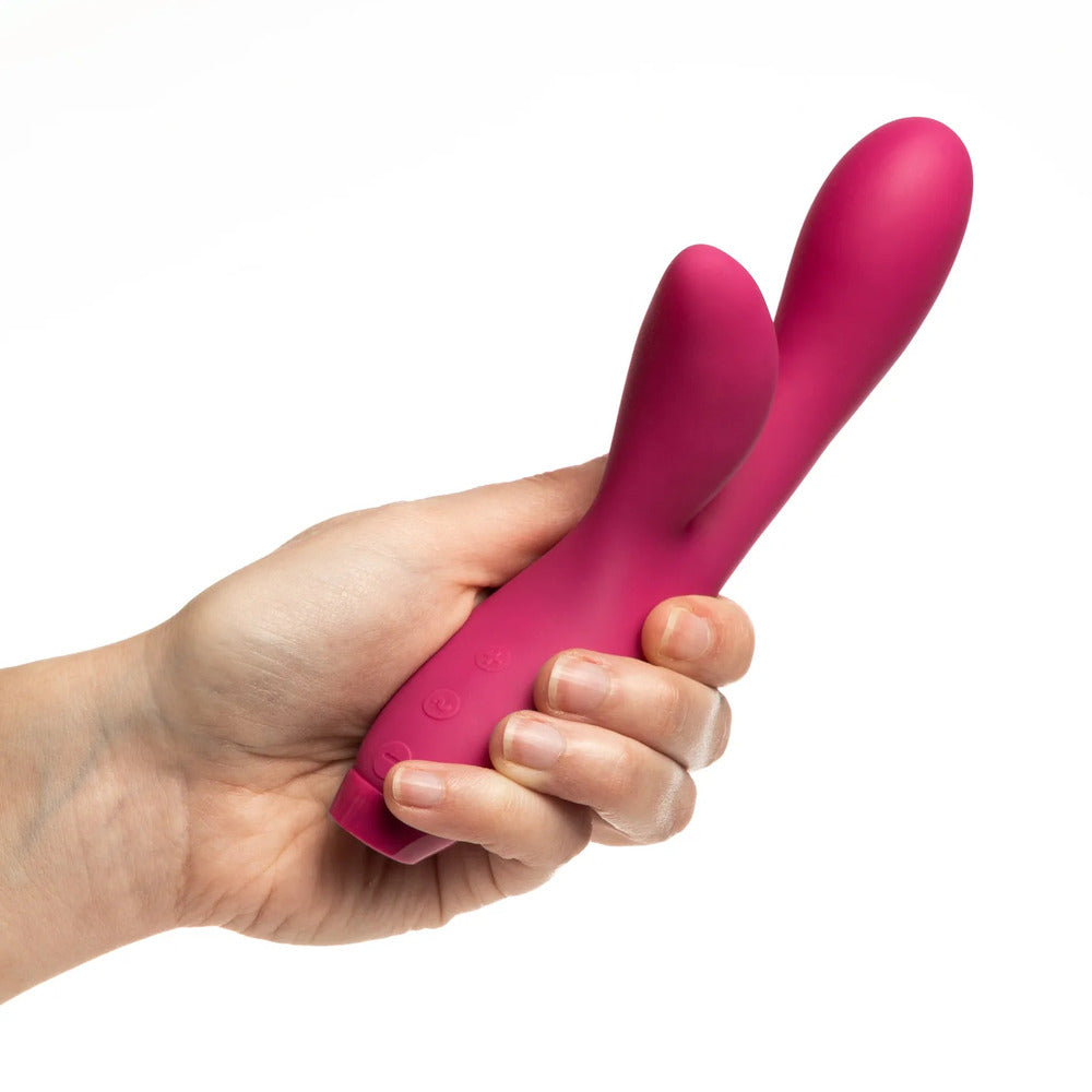 Sleek pink Je Joue Hera rabbit vibrator; a delightful bunny-shaped massager for pleasure.