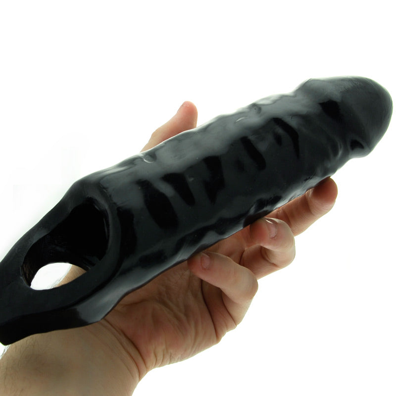 Extra large black penis sleeve by master series, enhancing size and pleasure during lovemaking.
