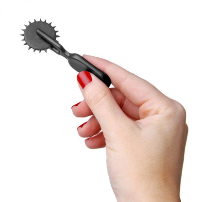 Medical sensation wheel with tactile patterns and rotating handle for medical assessments, examination.