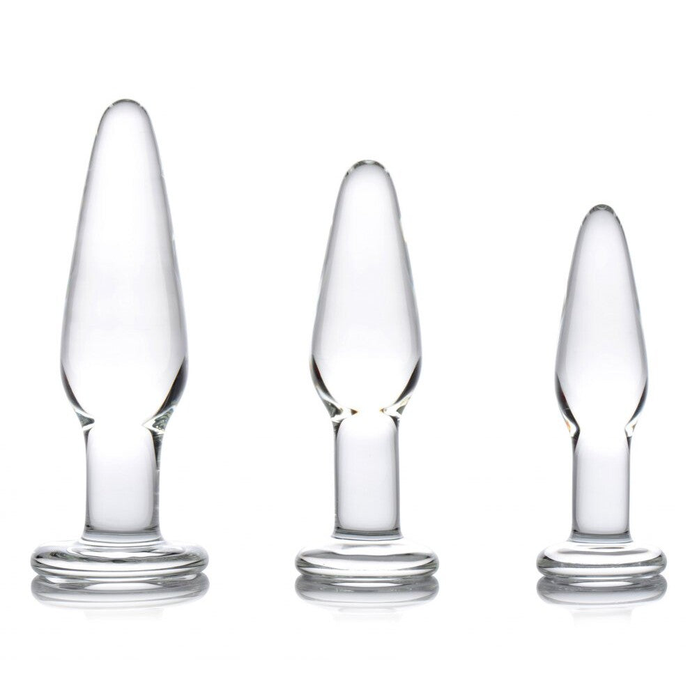 A set of three graduated, clear glass anal plugs with tapered ends for comfortable use.