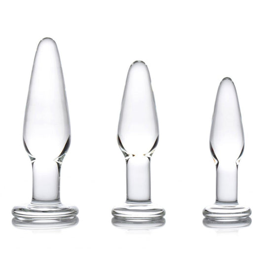 A set of three graduated, clear glass anal plugs with tapered ends for comfortable use.