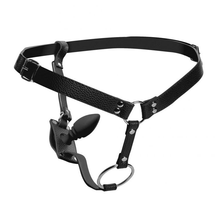 Black cock ring harness with silicone anal plug, for male bondage play.