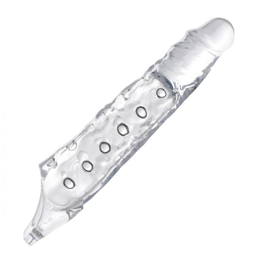 Close-up of a three inch clear penis extender sleeve, made of smooth, flexible material.
