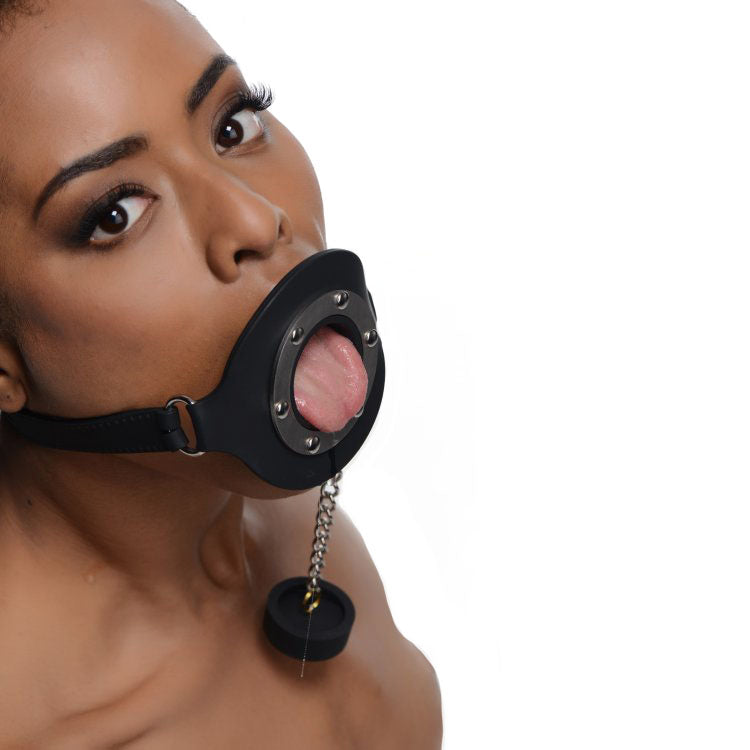 Black silicone pie hole gag for kinky feeding games, a cheeky accessory.