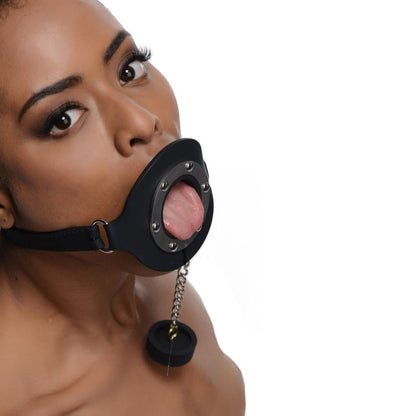 Black silicone pie hole gag for kinky feeding games, a cheeky accessory.
