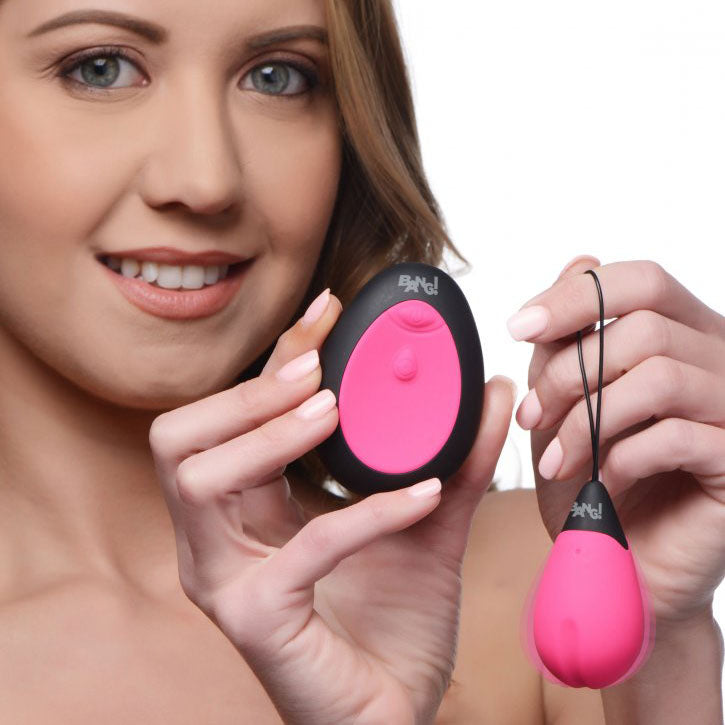 Close-up on a smooth, pink silicone 10X vibrating egg, perfect for discreet pleasure.