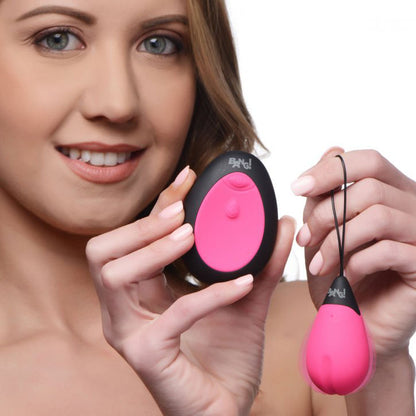 Close-up on a smooth, pink silicone 10X vibrating egg, perfect for discreet pleasure.