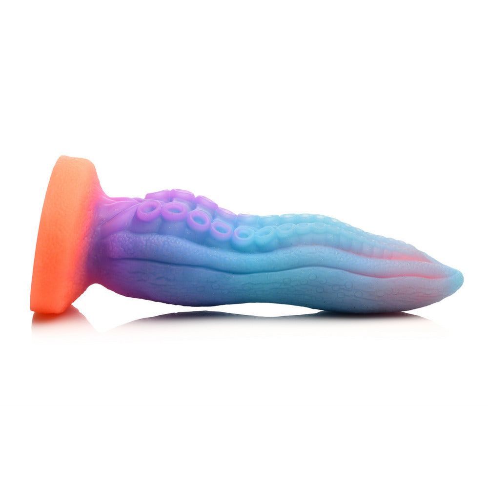 Glow-in-the-dark tentacle-textured dildo, a fantastical creature cock by XR Brands, designed for pleasure.