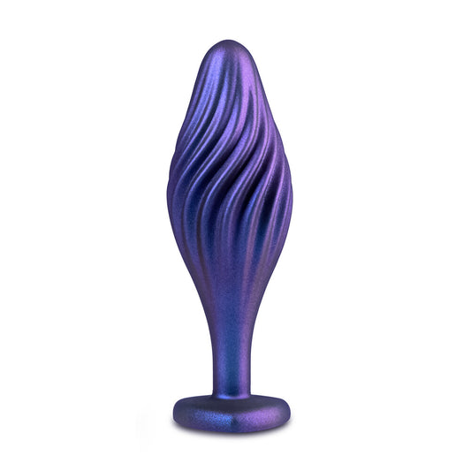 A shimmering, swirling butt plug from blush novelties, designed for anal play and pleasure.